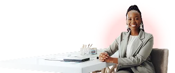 Smiling insurance professional seated at a desk in an office