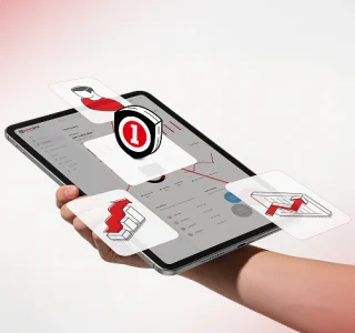 Hand holding a tablet displaying insurance-related icons