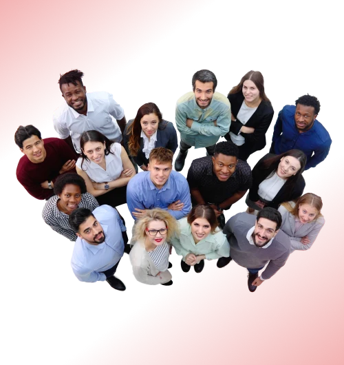 A diverse group of coworkers stands together and looks up at the camera.
